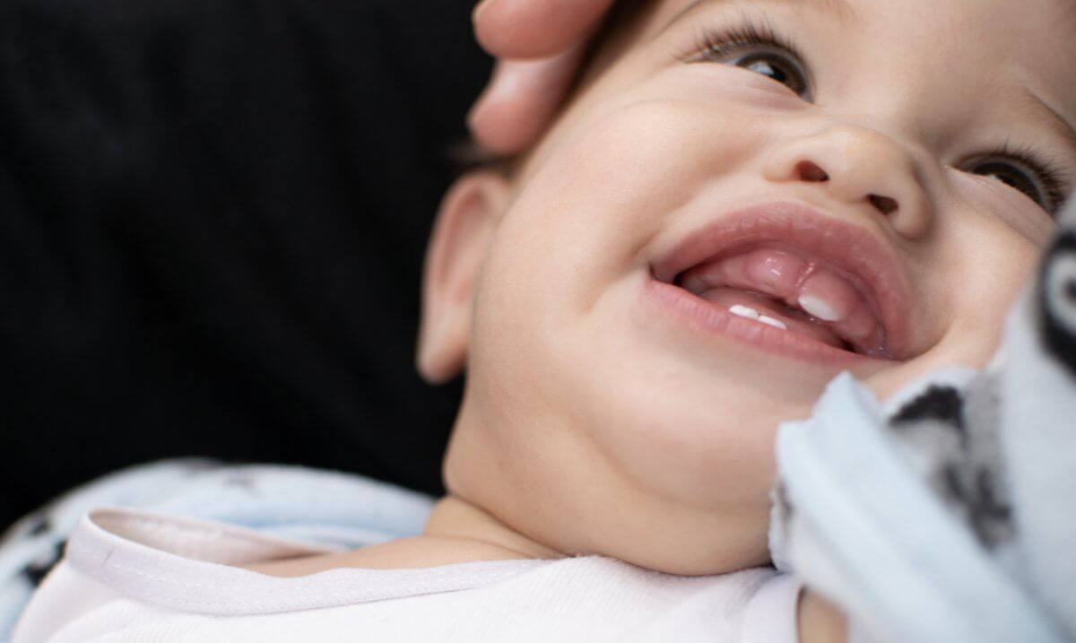 Baby teething showing big smile